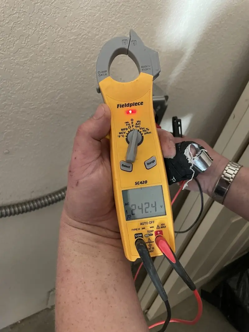 Voltage testing with clamp meter during Whole House Surge Protector in Everman
